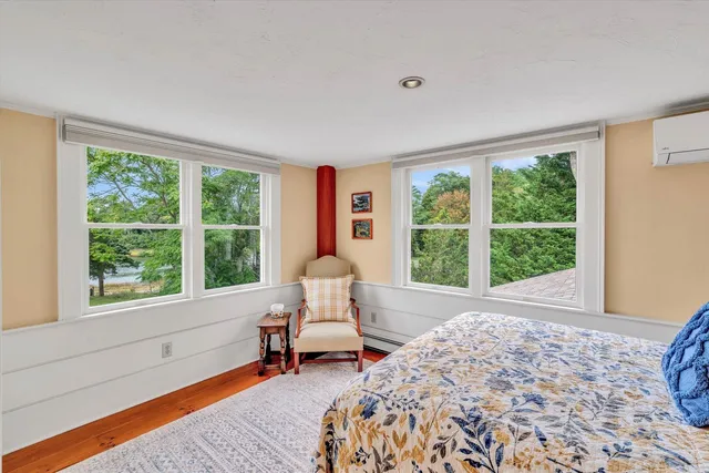 a living room with furniture and a book shelf