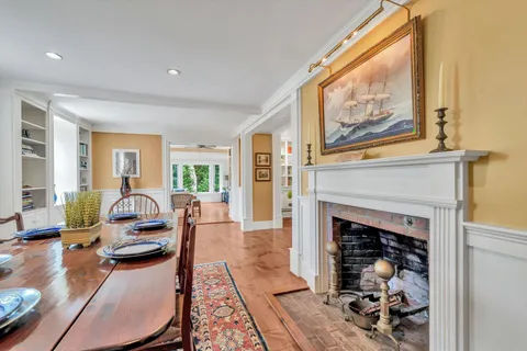 a view of a patio with couches chairs and a yard