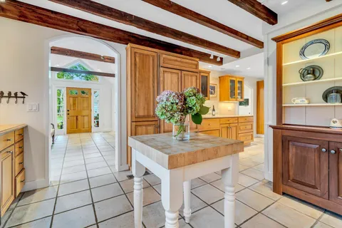 a view of a chairs and table in patio