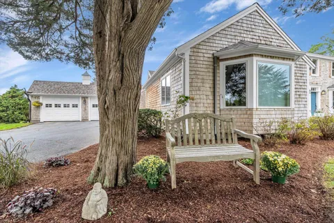a view of a living room with a large window and bed