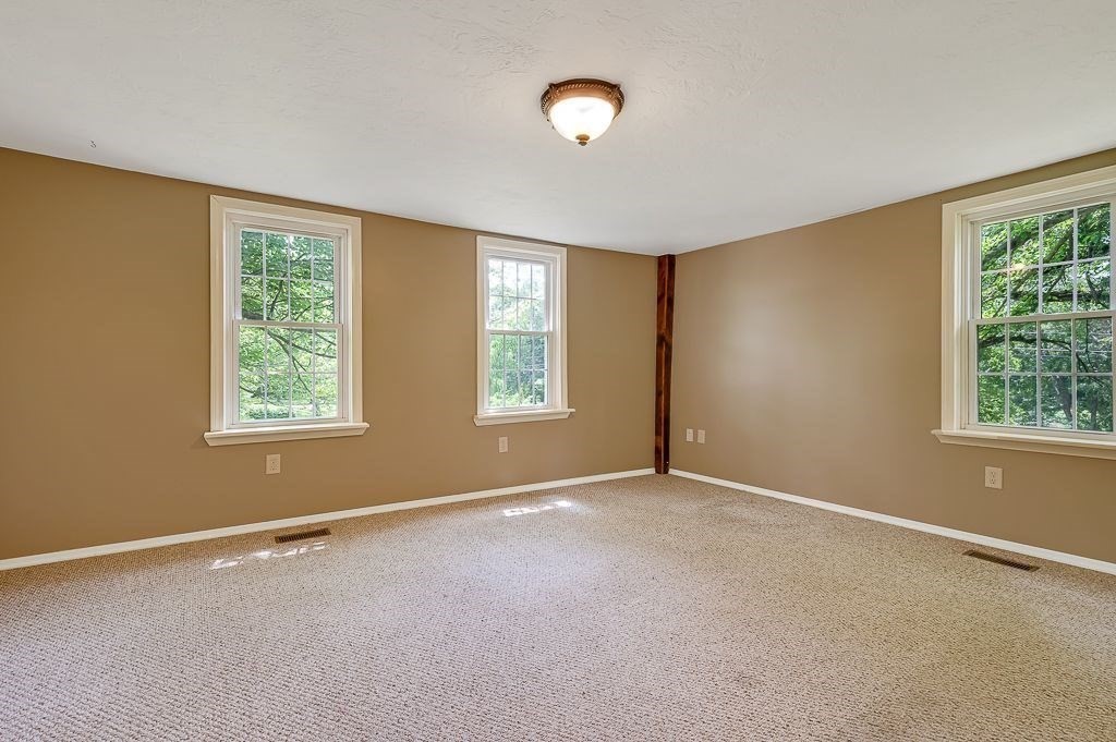 67 Stone School Road Sutton, MA 01590 - Photo 24 of 41 a view of an empty room with a window