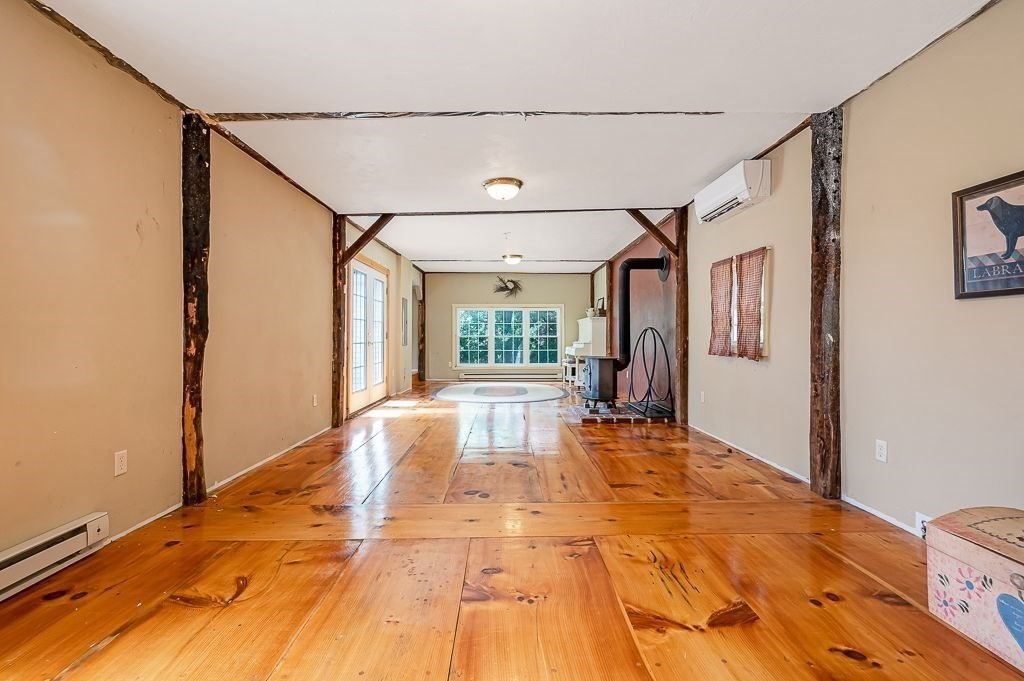 67 Stone School Road Sutton, MA 01590 - Photo 5 of 41 a large white bed in a white room