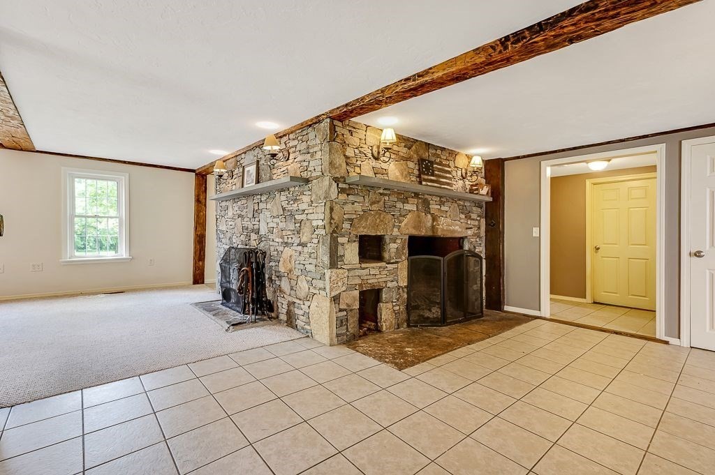 67 Stone School Road Sutton, MA 01590 - Photo 9 of 41 a view of a livingroom with furniture and a fireplace
