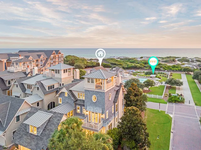a living room with furniture a chandelier and a table