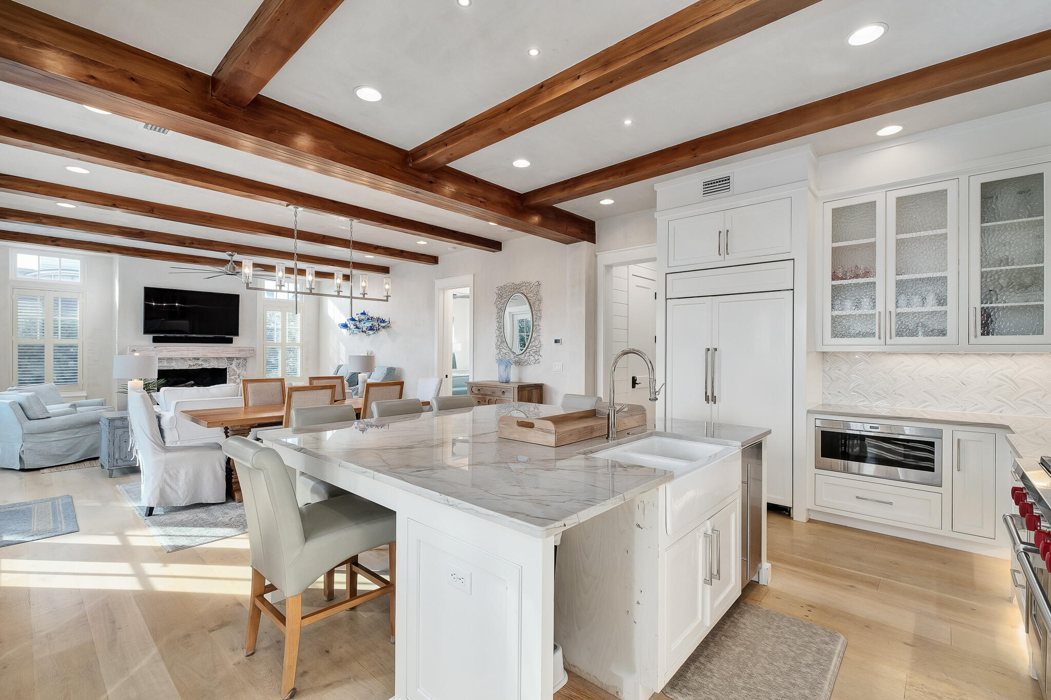 409 Coopersmith Lane Inlet Beach, FL 32461 - Photo 31 of 97 a open kitchen with stainless steel appliances kitchen island granite countertop a table chairs and a refrigerator