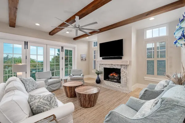a bedroom with furniture and a flat screen tv