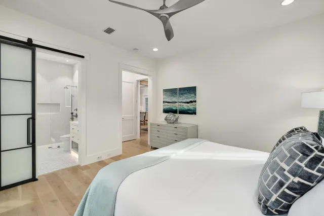 a view of a city with tall buildings and a cars park side of the road