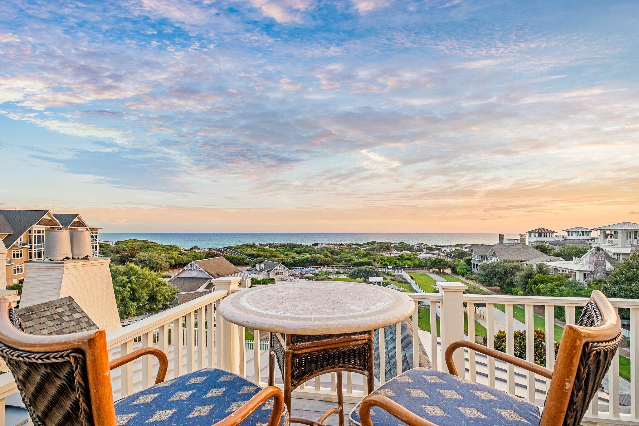 409 Coopersmith Lane Inlet Beach, FL 32461 - Photo 70 of 97 a view of a city from a roof deck with furniture