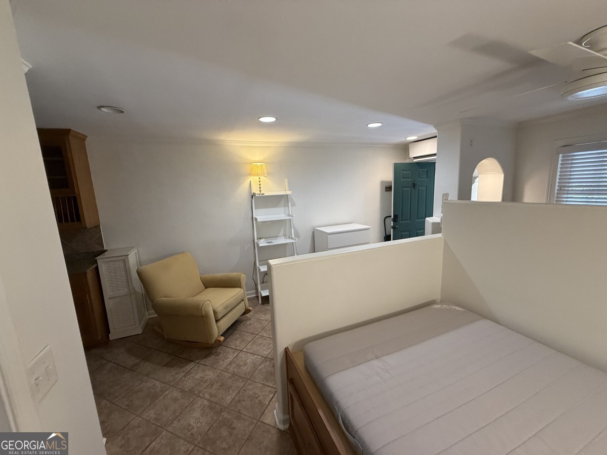 655 East Campus Road Athens, GA 30605 - Photo 13 of 13 a living room with furniture and a large window