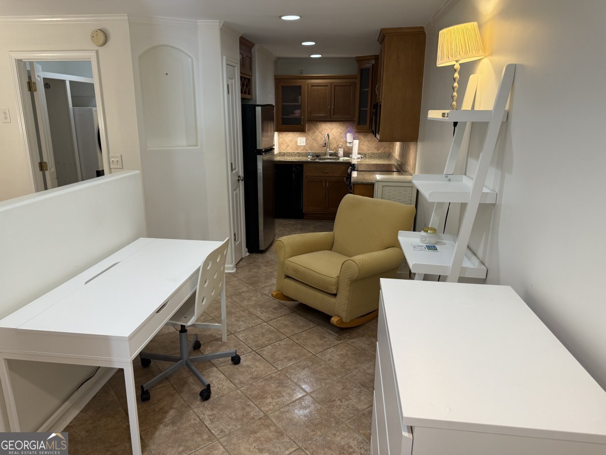 655 East Campus Road Athens, GA 30605 - Photo 6 of 13 a living room with furniture and a large window