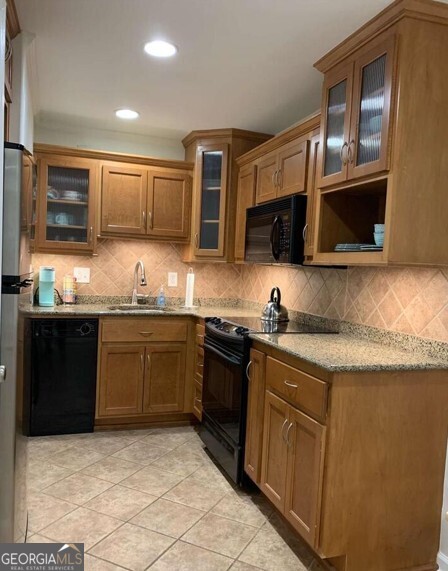 655 East Campus Road Athens, GA 30605 - Photo 8 of 13 a kitchen with granite countertop a sink and steel appliances