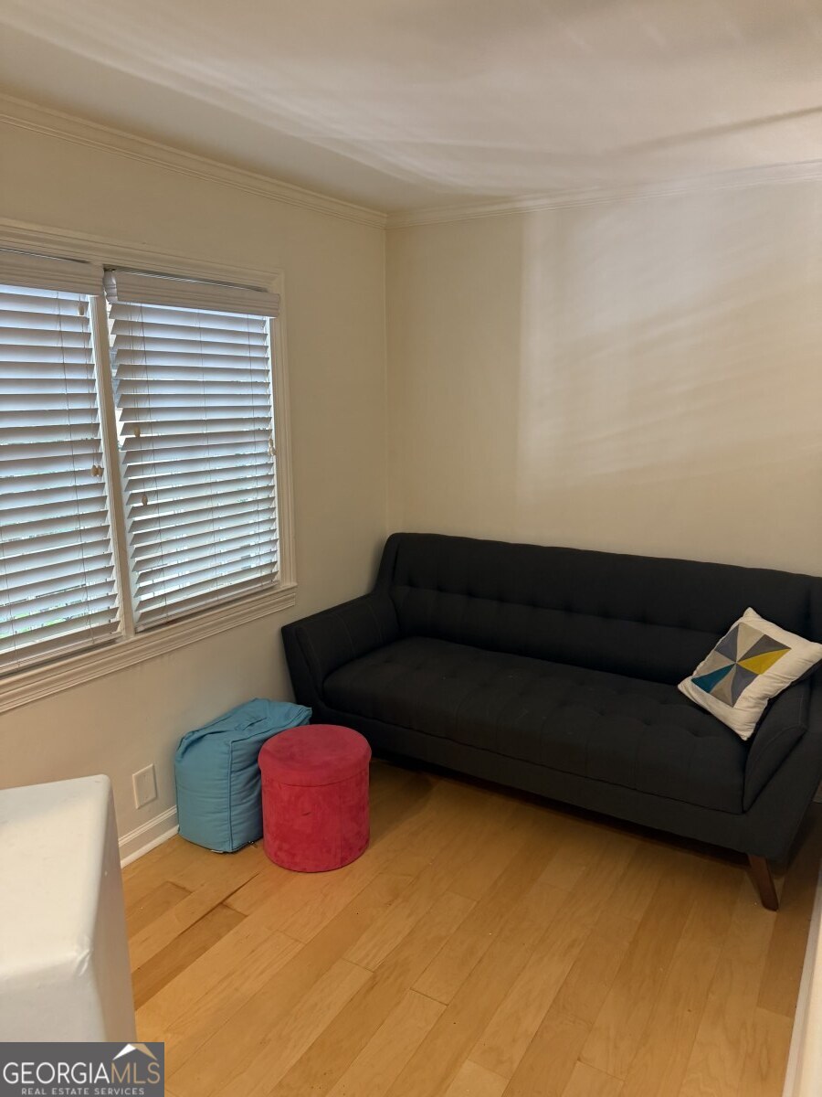 655 East Campus Road Athens, GA 30605 - Photo 9 of 13 a living room with a couch and a window