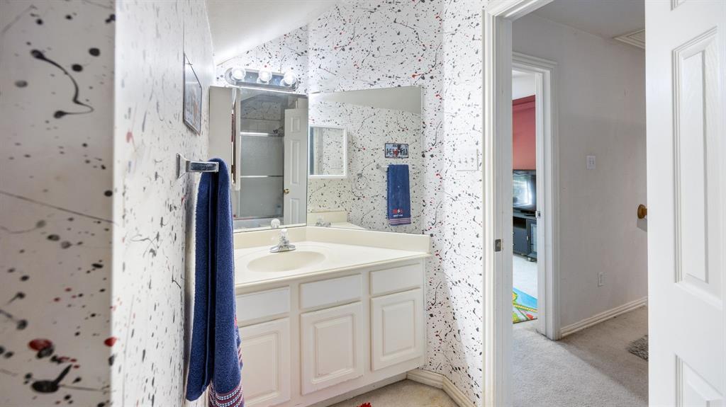 1508 Valley Creek Road Denton, TX 76205 - Photo 29 of 33 a bathroom with a sink and a mirror