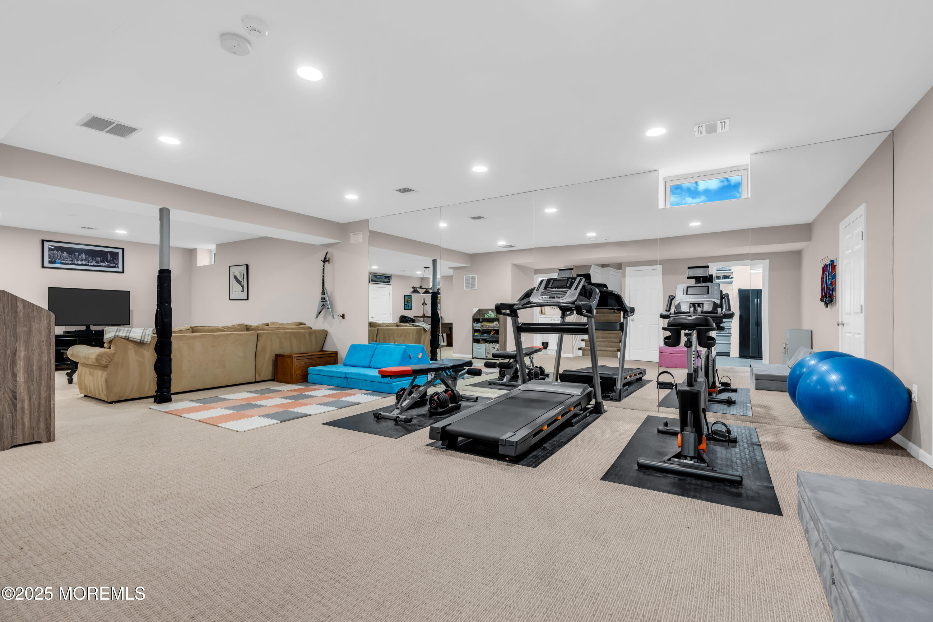 12 Forrest Avenue Rumson, NJ 07760 - Photo 14 of 55 a view of a room with gym equipment and a large window