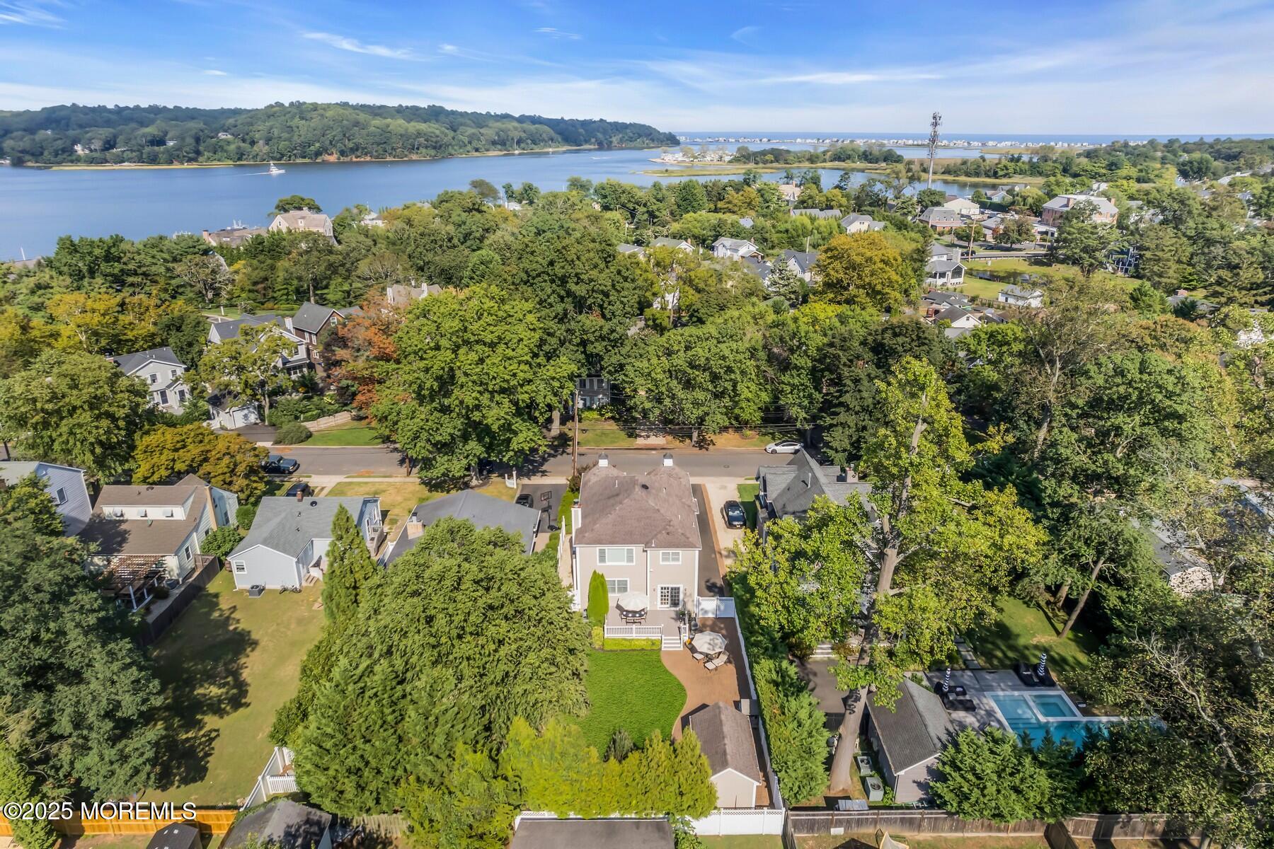 12 Forrest Avenue Rumson, NJ 07760 - Photo 32 of 55 an aerial view of a city with lots of residential buildings lake and mountain view in back