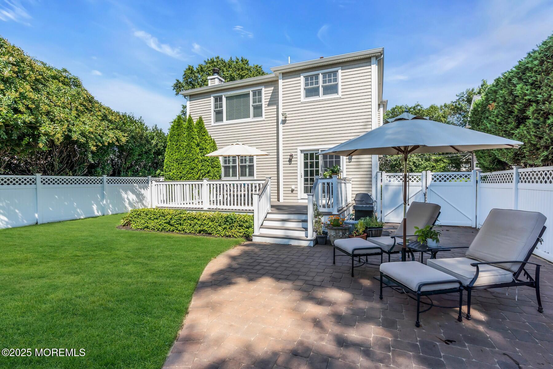 12 Forrest Avenue Rumson, NJ 07760 - Photo 52 of 55 a view of a house with backyard sitting area and garden