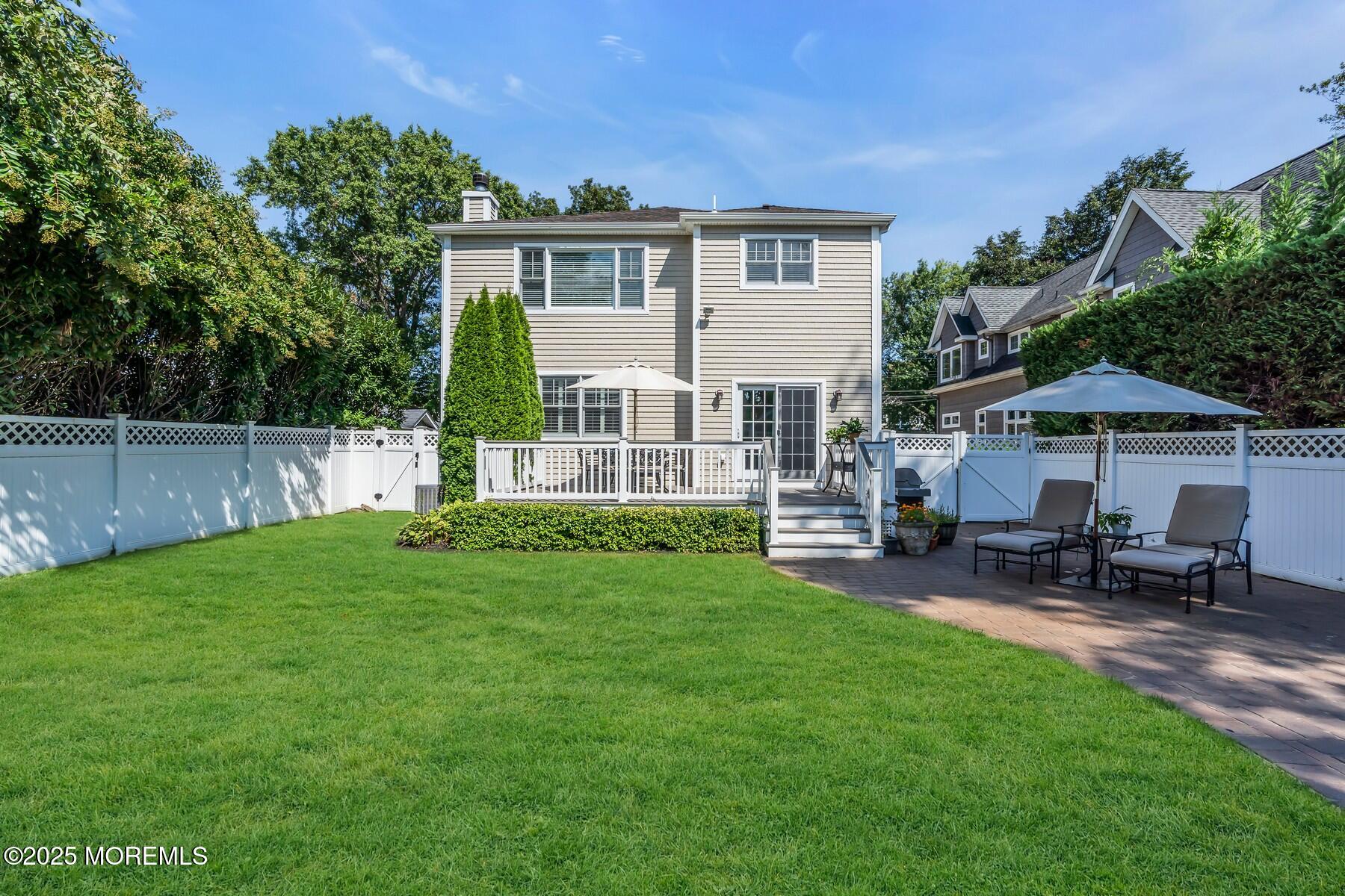 12 Forrest Avenue Rumson, NJ 07760 - Photo 53 of 55 a view of a house with a yard and sitting area