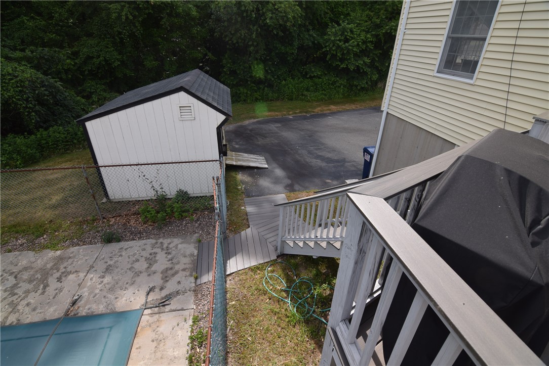 8 Pequot Avenue Westerly, RI 02891 - Photo 31 of 33 There are two separate stair cases leading from deck to pool area, driveway and rear yard.