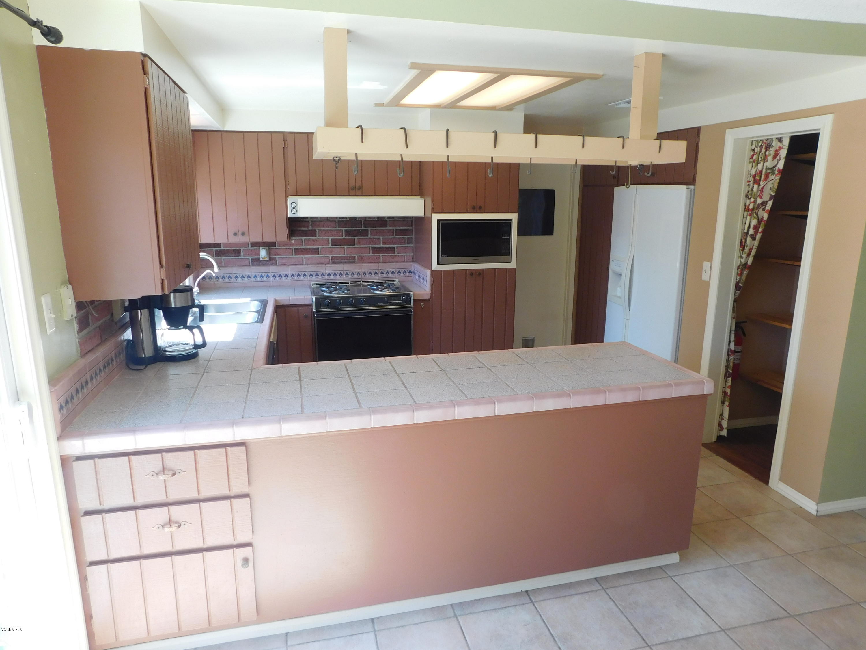 2105 Rhoda Street Simi Valley, CA 93065 - Photo 2 of 15 a kitchen with stainless steel appliances a refrigerator and a sink