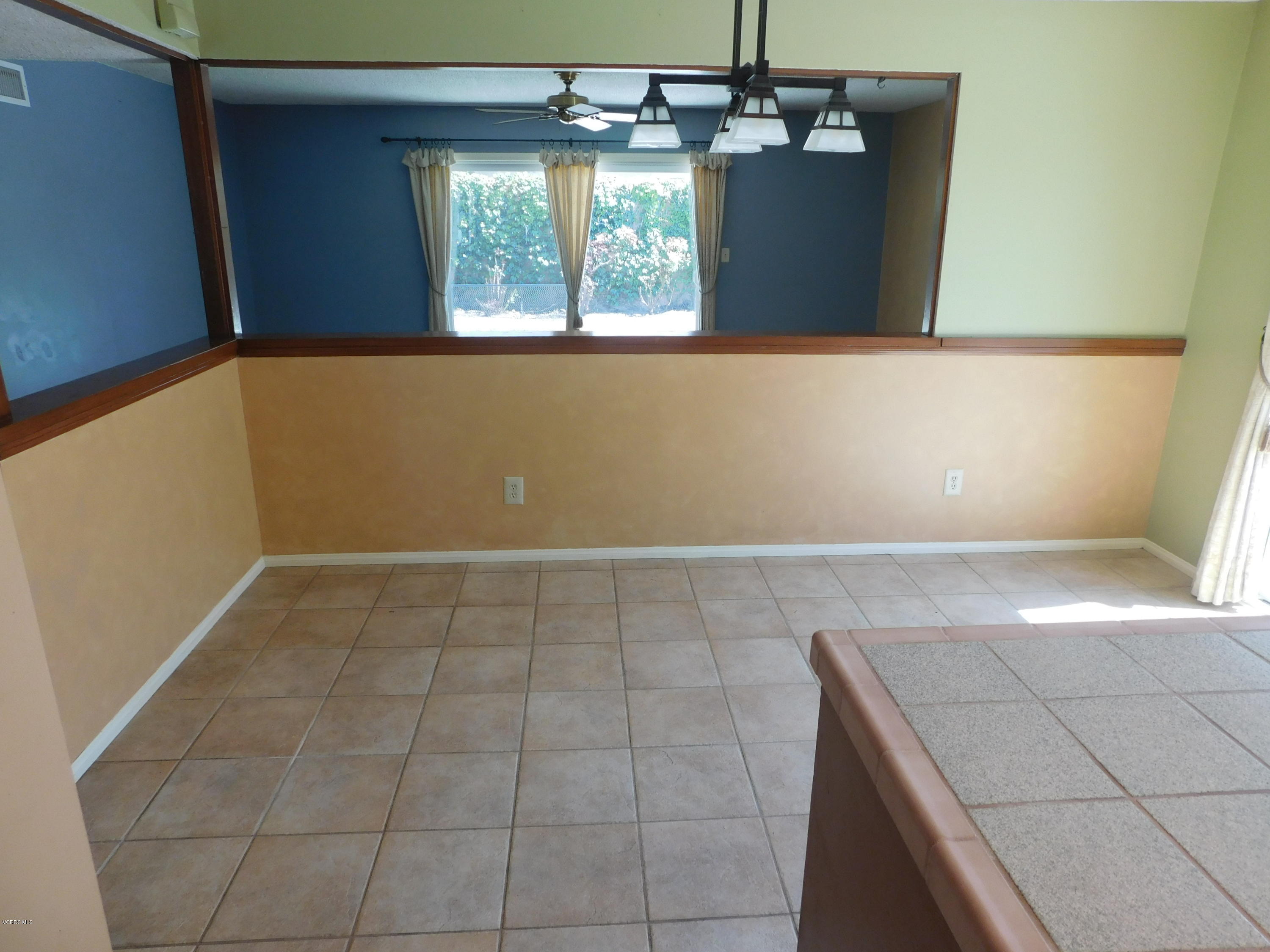 2105 Rhoda Street Simi Valley, CA 93065 - Photo 5 of 15 a view of a kitchen with a dishwasher cabinet and a fireplace
