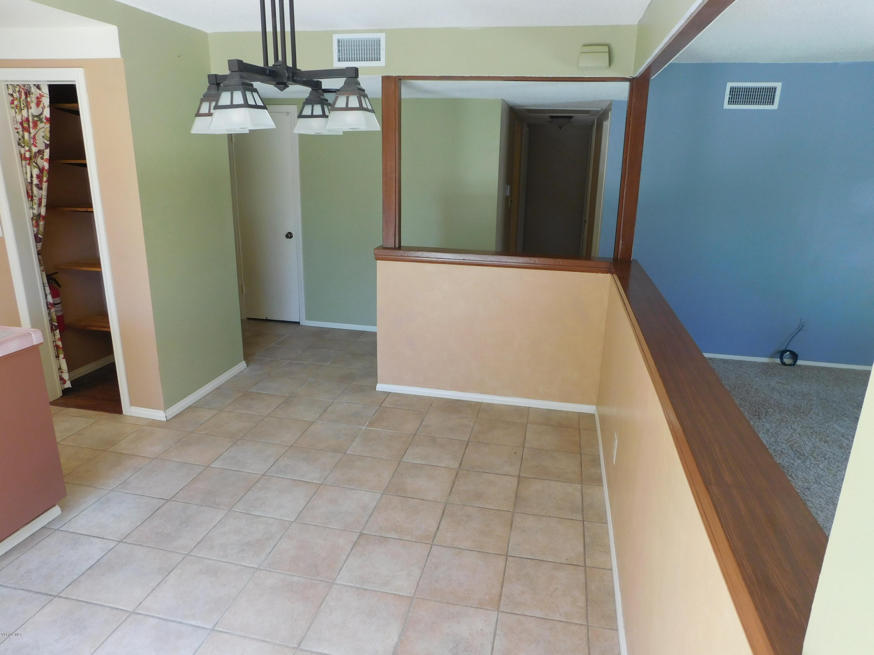 2105 Rhoda Street Simi Valley, CA 93065 - Photo 6 of 15 a view of a hallway with wooden floor and staircase