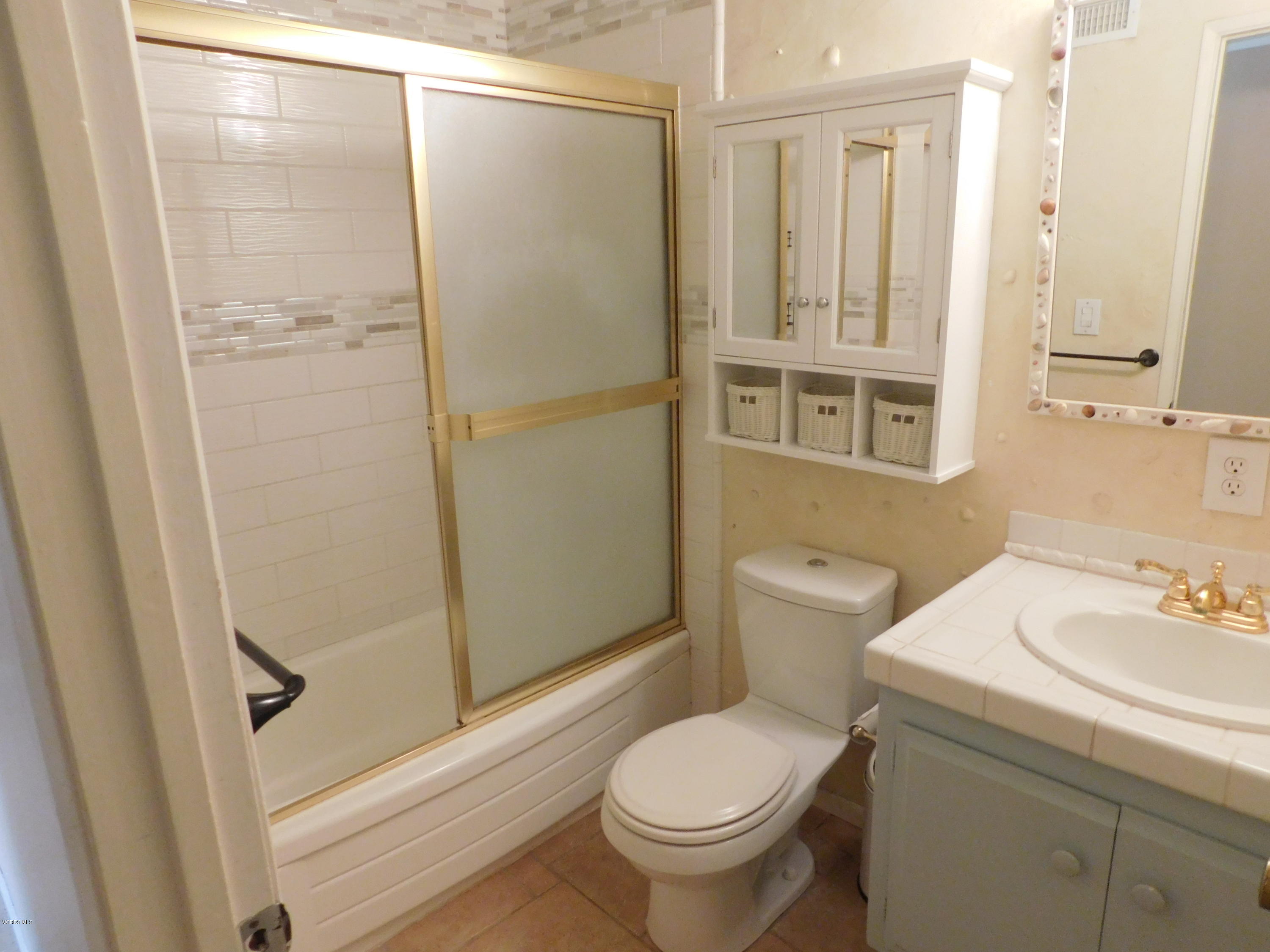 2105 Rhoda Street Simi Valley, CA 93065 - Photo 8 of 15 a bathroom with a sink toilet and shower