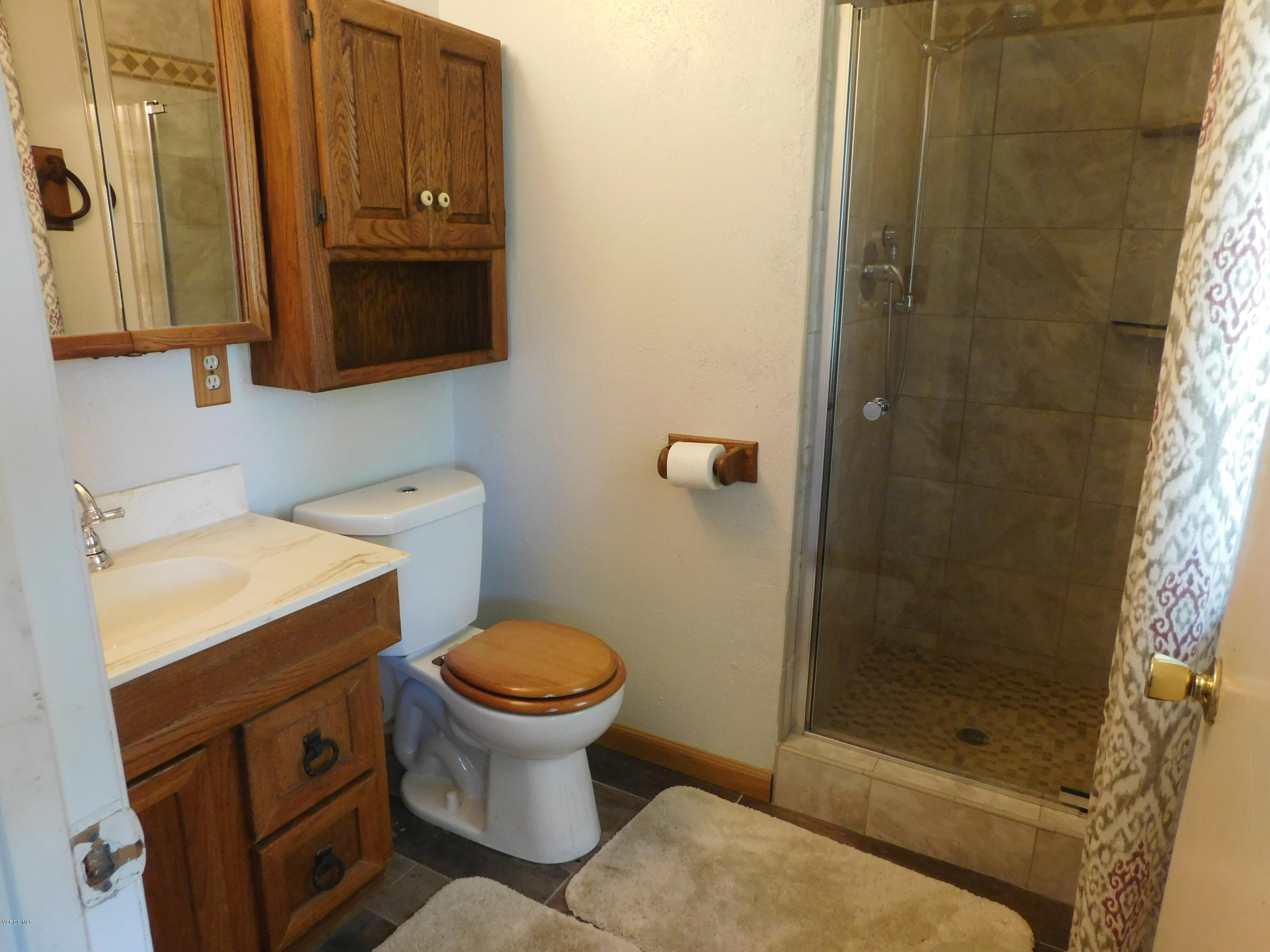 2105 Rhoda Street Simi Valley, CA 93065 - Photo 9 of 15 a bathroom with a sink toilet and shower