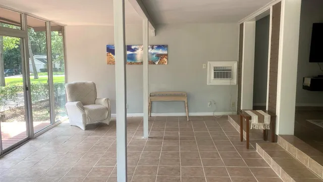 a spacious bathroom with a toilet and a shower