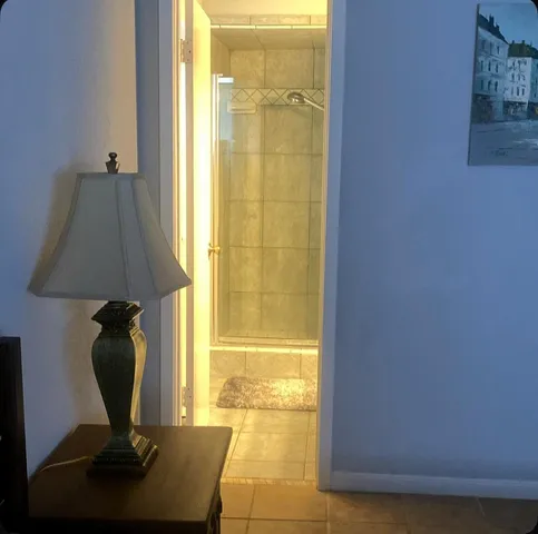 a view of a bathroom with a tub and window