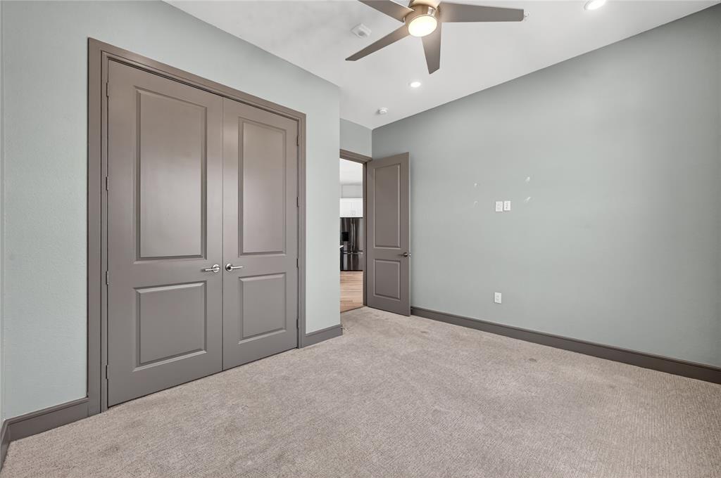 2700 Old Denton Road, Unit 2259 Carrollton, TX 75007 - Photo 26 of 39 an empty room with closet and a ceiling fan