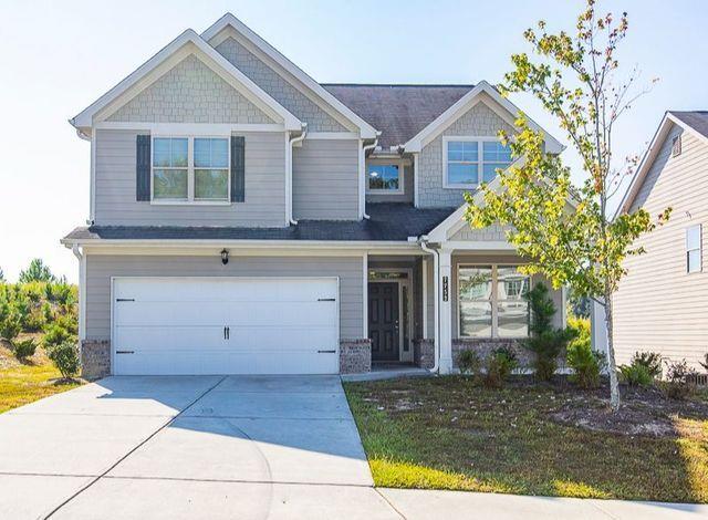 a view of a brick house with a large windows