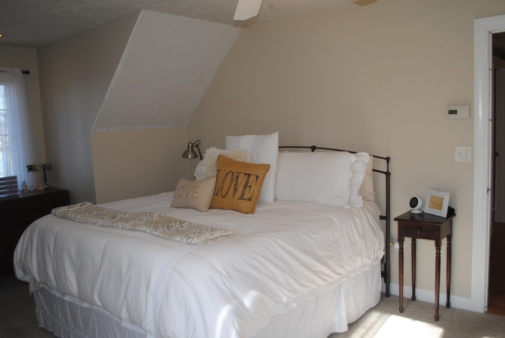 518 Douglas Road Northbridge, MA 01588 - Photo 16 of 41 a bedroom with a bed and a night stand