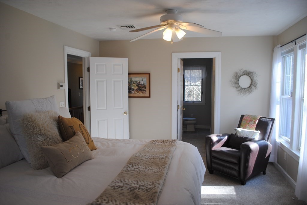 518 Douglas Road Northbridge, MA 01588 - Photo 17 of 41 a bedroom with a bed and ceiling fan