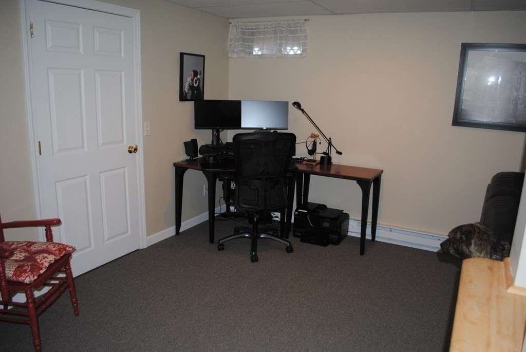 518 Douglas Road Northbridge, MA 01588 - Photo 28 of 41 a view of a workspace with furniture and a window