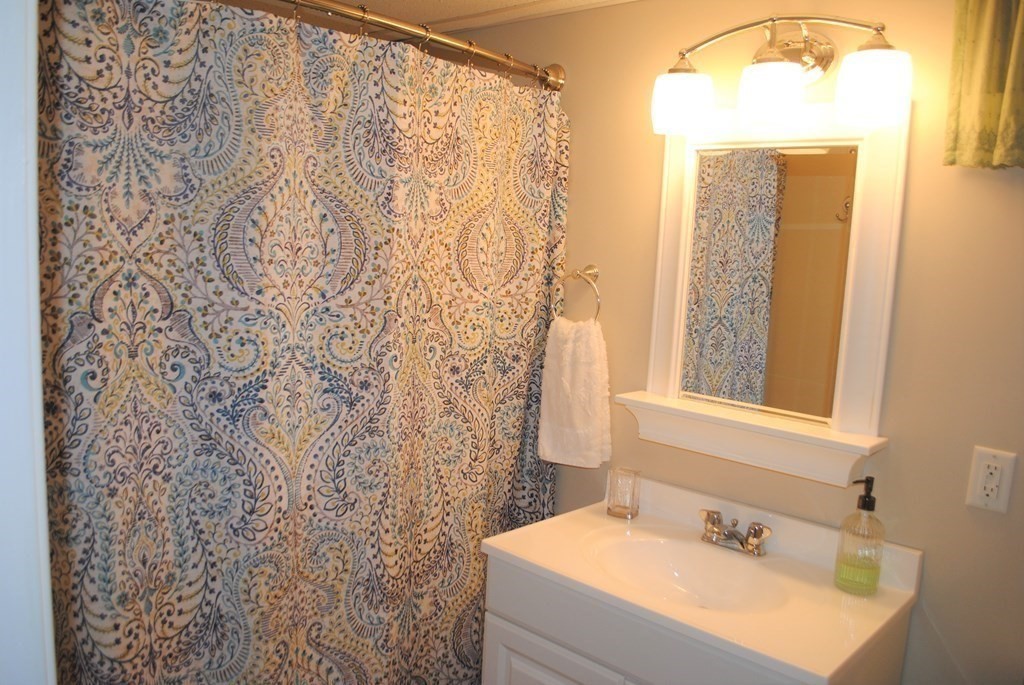 518 Douglas Road Northbridge, MA 01588 - Photo 31 of 41 a bathroom with a sink and a mirror