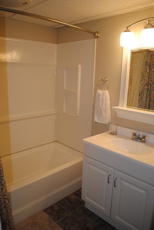 518 Douglas Road Northbridge, MA 01588 - Photo 32 of 41 a bathroom with a sink and a mirror