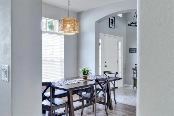 a view of a dining room with furniture and window