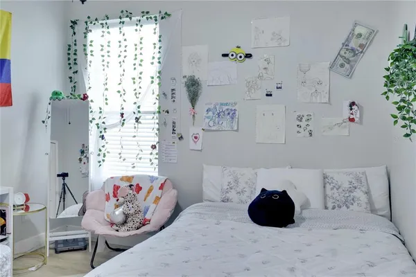 a bedroom with a bed and a couch