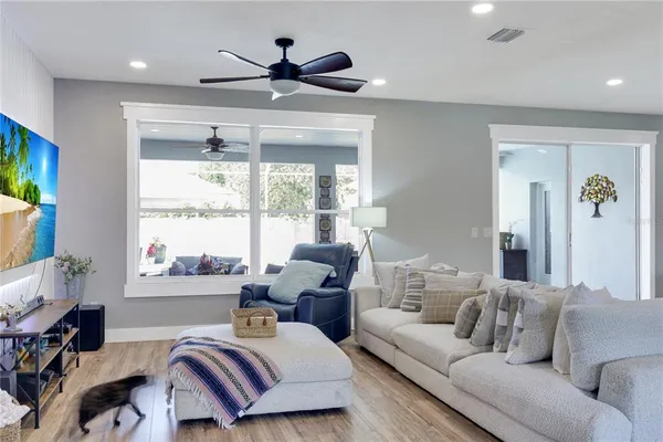a living room with furniture and a large window