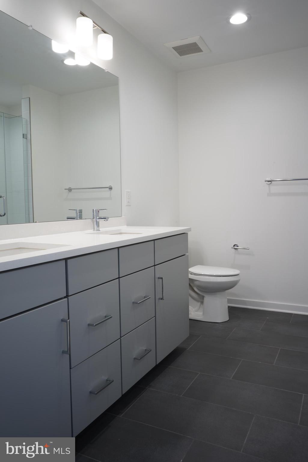 3130 Pierview Lane Philadelphia, PA 19125 - Photo 12 of 26 a bathroom with a toilet sink and mirror