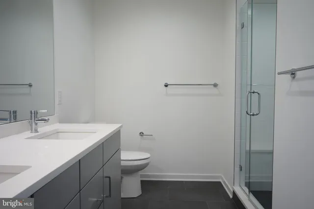 a bathroom with a sink toilet and vanity