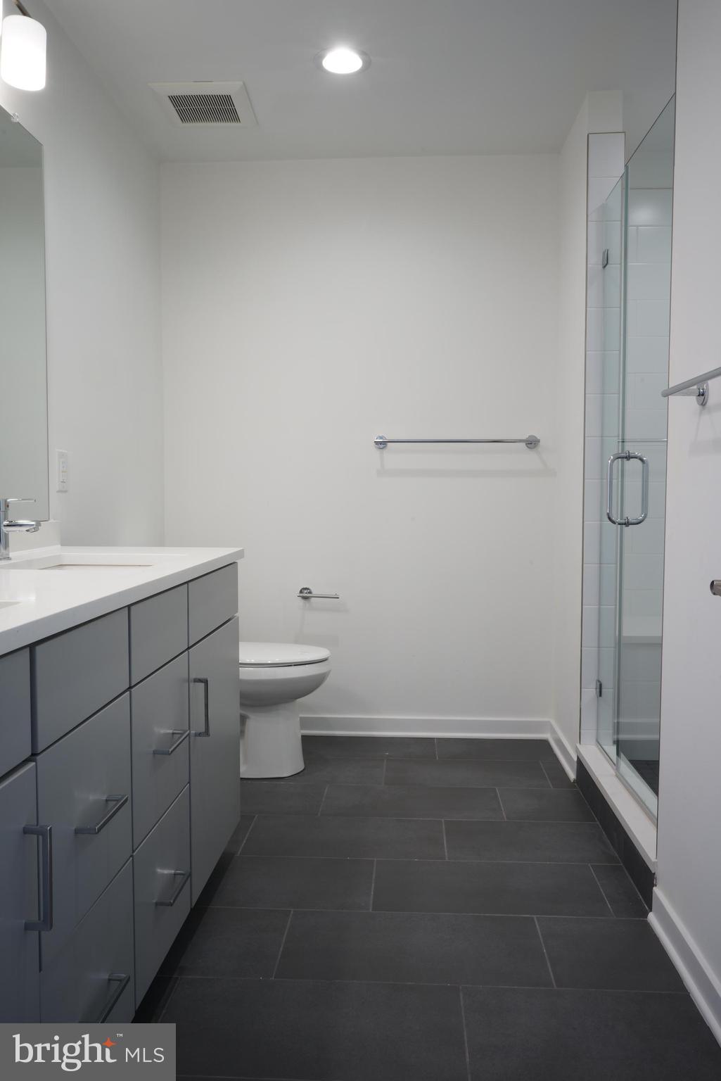3130 Pierview Lane Philadelphia, PA 19125 - Photo 22 of 26 a bathroom with a sink a toilet and shower