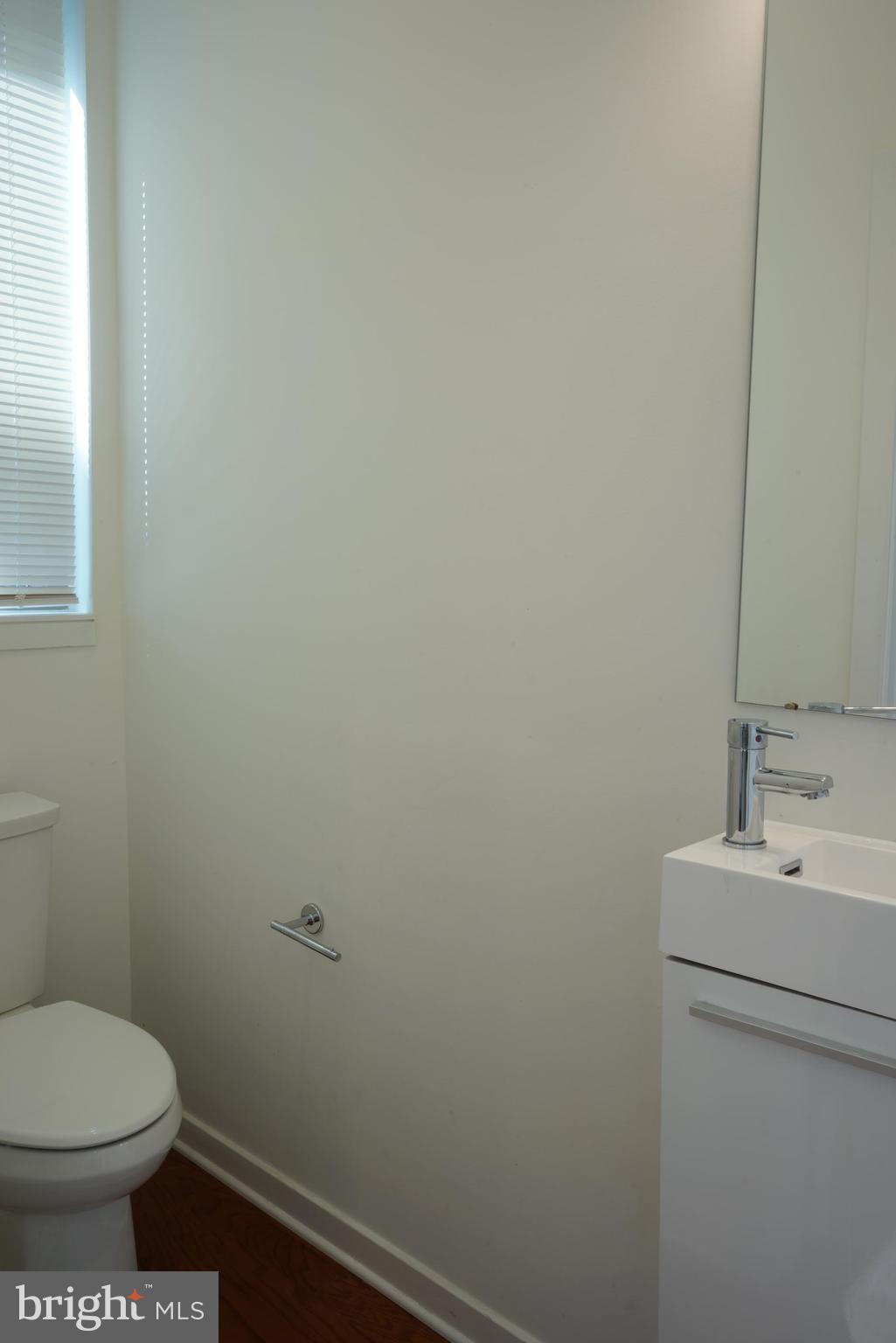 3130 Pierview Lane Philadelphia, PA 19125 - Photo 9 of 26 a bathroom with a sink toilet and a mirror