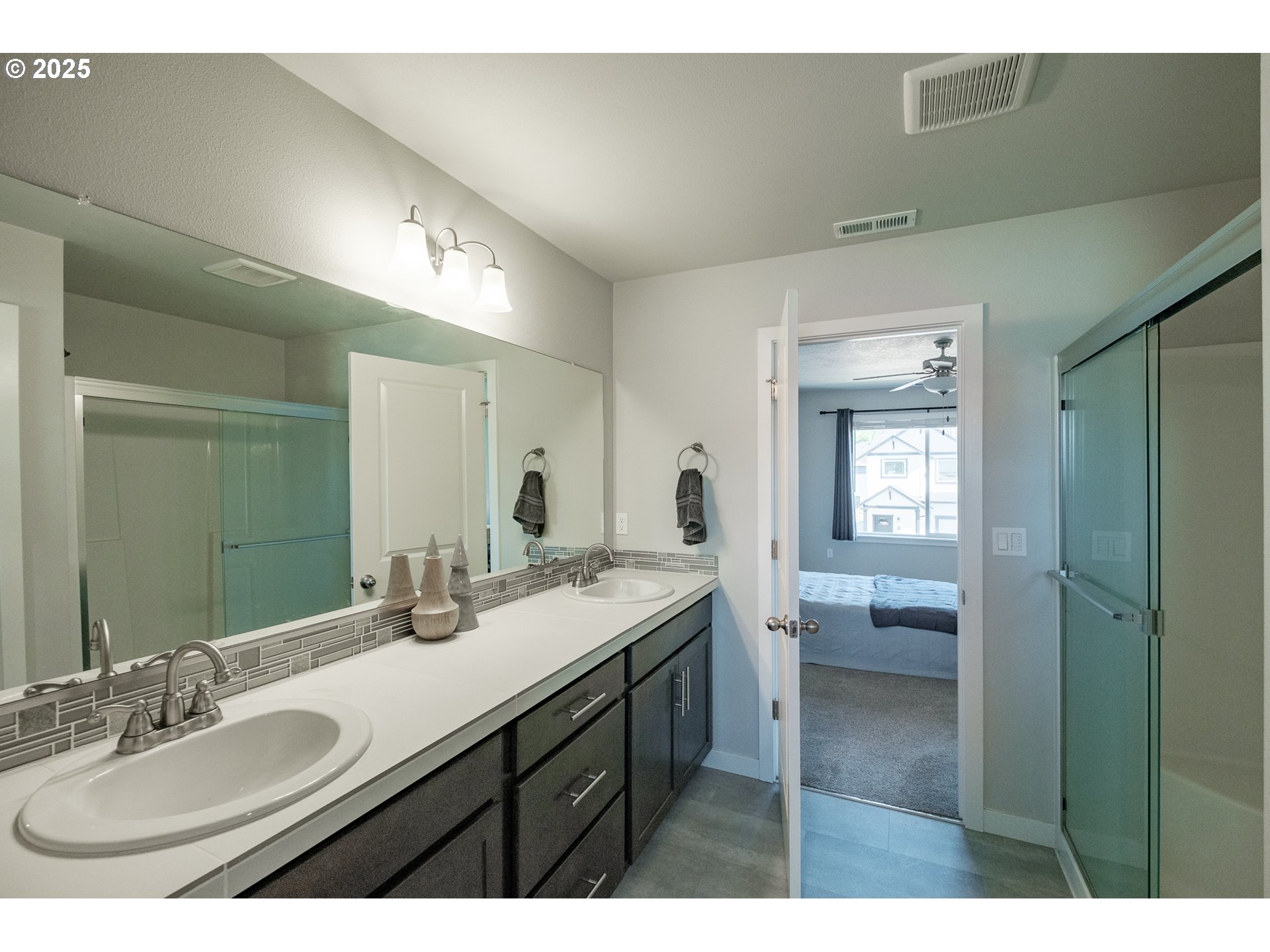 4465 Ninebark Loop Sweet Home, OR 97386 - Photo 15 of 23 a bathroom with a sink double vanity granite and a mirror