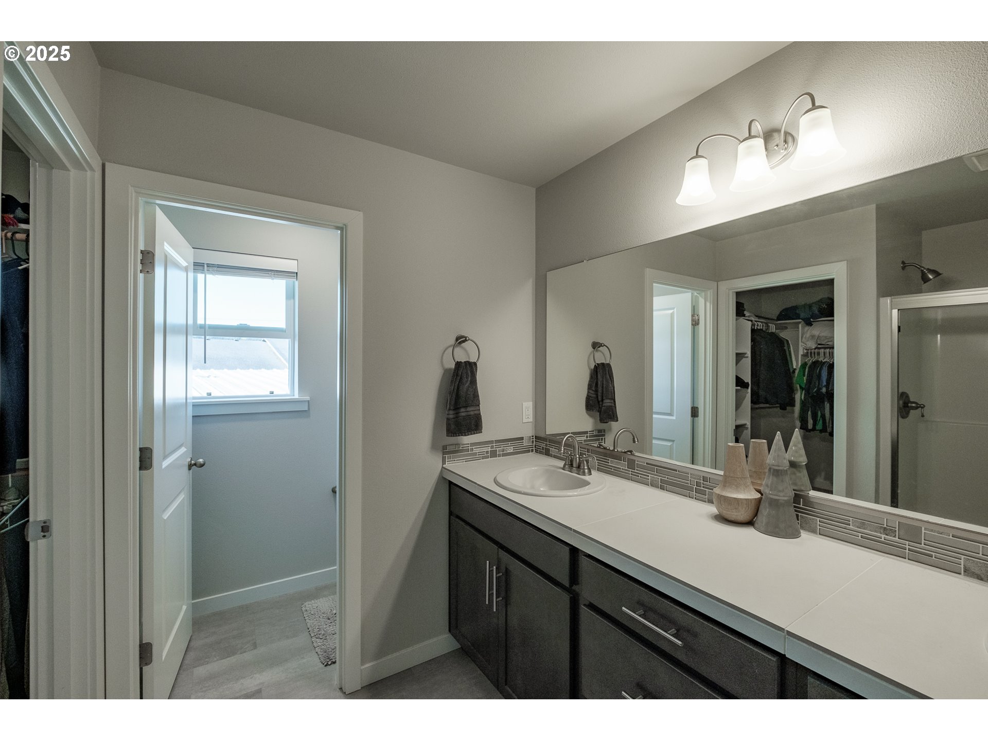 4465 Ninebark Loop Sweet Home, OR 97386 - Photo 16 of 23 a bathroom with a sink a mirror and a vanity