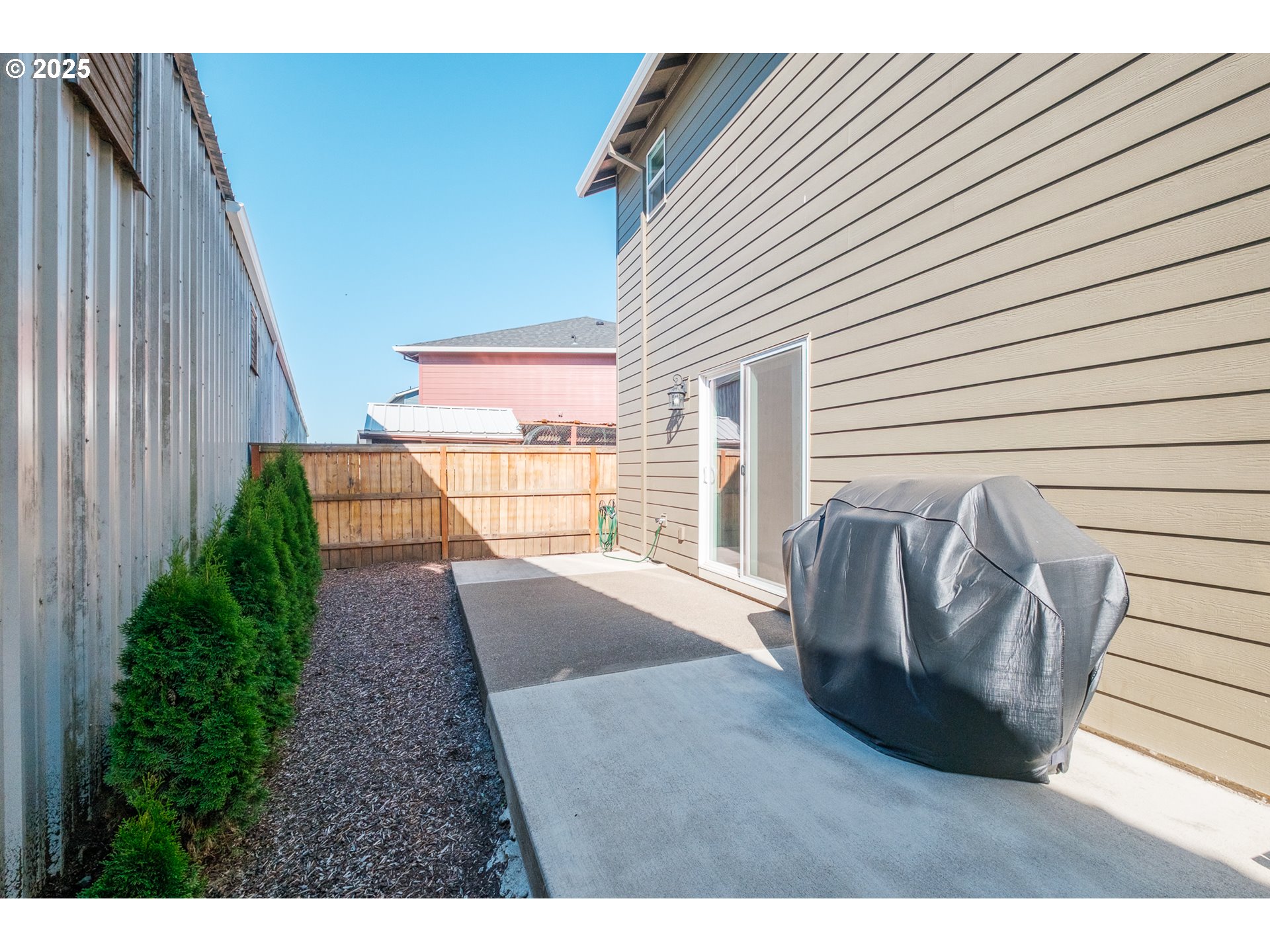 4465 Ninebark Loop Sweet Home, OR 97386 - Photo 18 of 23 a view of a porch with furniture and floor to ceiling window