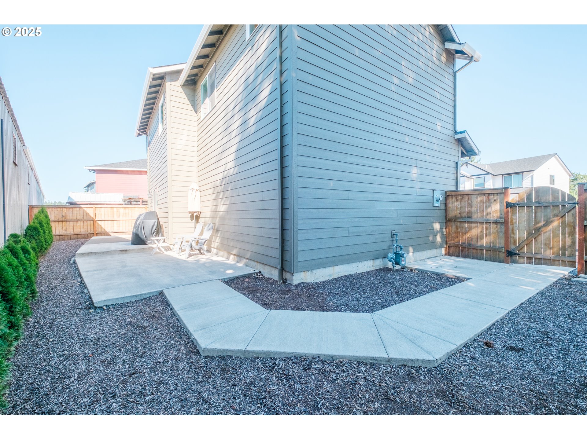 4465 Ninebark Loop Sweet Home, OR 97386 - Photo 22 of 23 a view of a backyard with sitting area