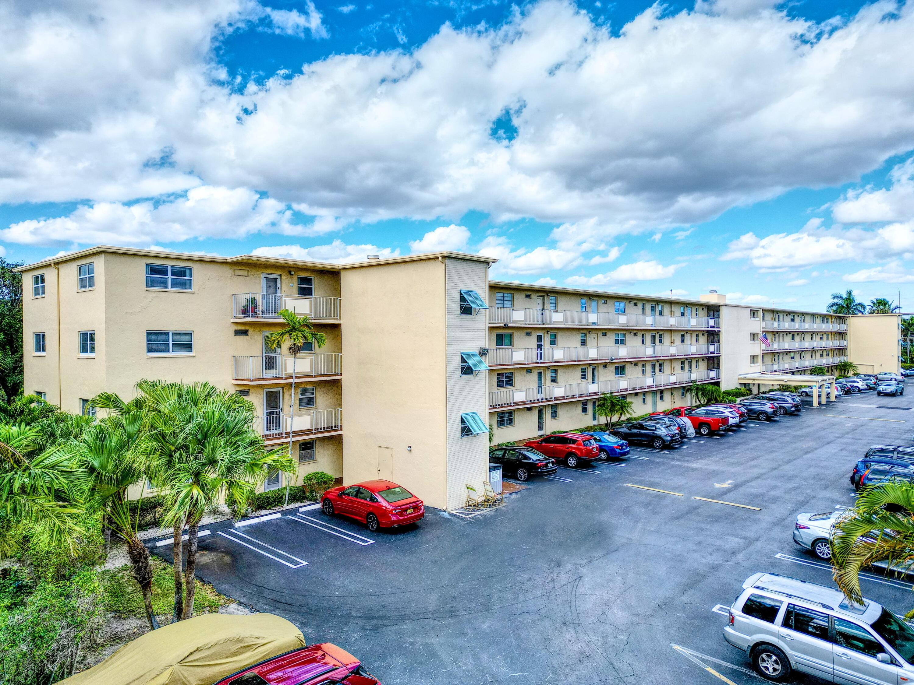 2615 Northeast 3rd Street, Unit 317 Boynton Beach, FL 33435 - Photo 2 of 41 a view of a street with cars