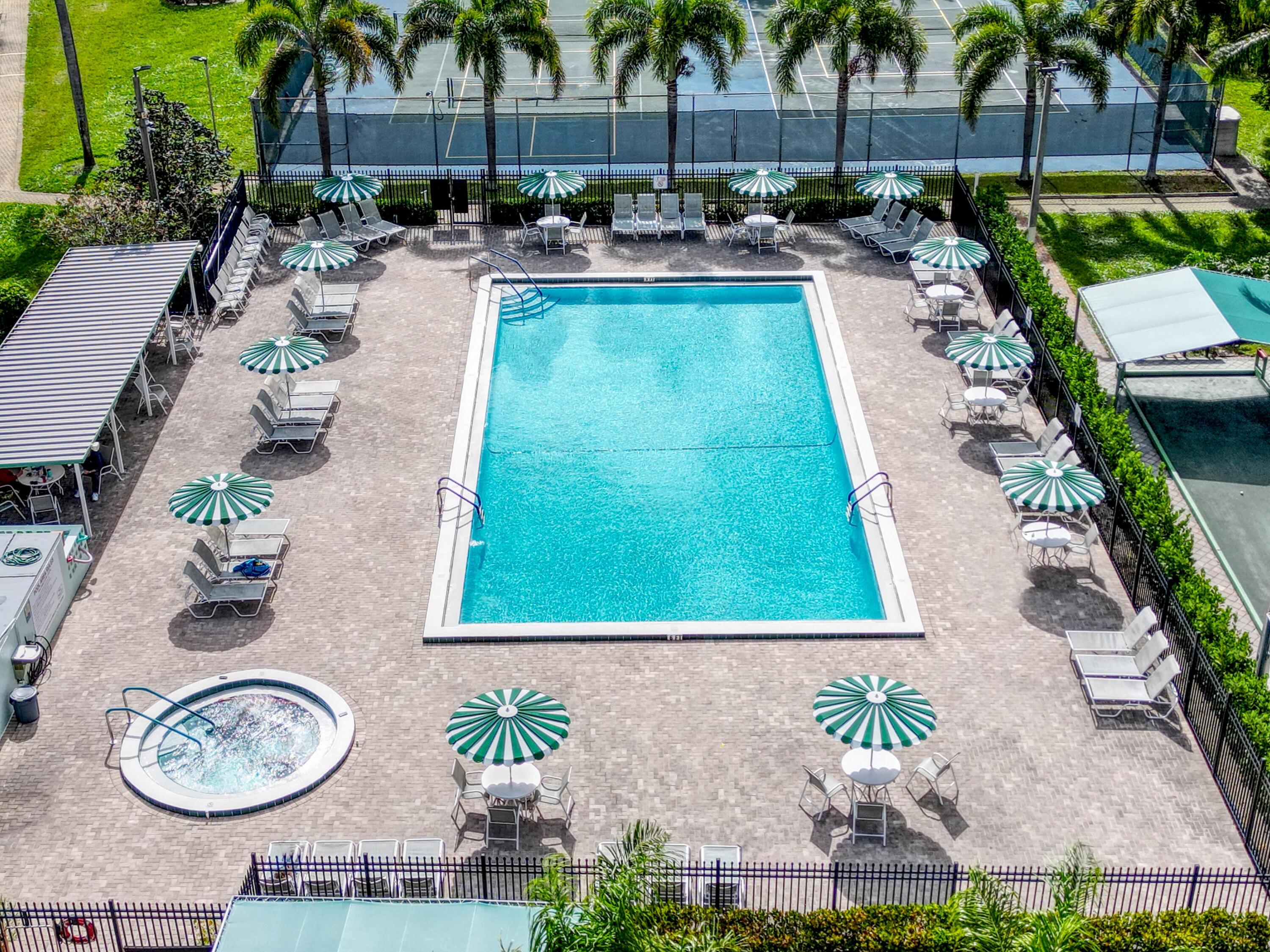 2615 Northeast 3rd Street, Unit 317 Boynton Beach, FL 33435 - Photo 30 of 41 an outdoor space with patio and chairs