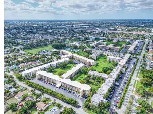 a kitchen with white cabinets a sink and dishwasher